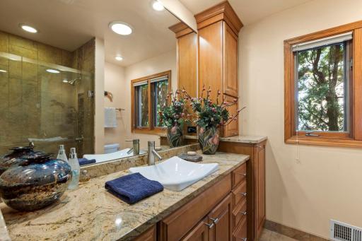 The main floor Bath features custom updates and a walk-in shower