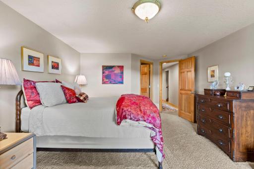 a luxury Bedroom suite with fireplace and glass door to the patio is on the lower level