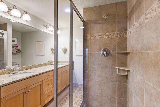 The Lower level also boasts a luxury bath with a large bubble tub and a separate walk-in shower