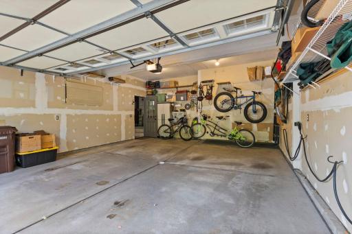 The spacious garage is sheet rocked and features a floor drain