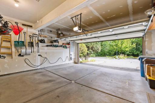 The spacious garage is sheet rocked and features a floor drain
