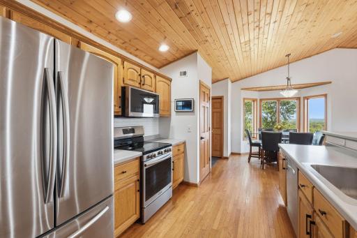 Kitchen toward dining area and garage entry