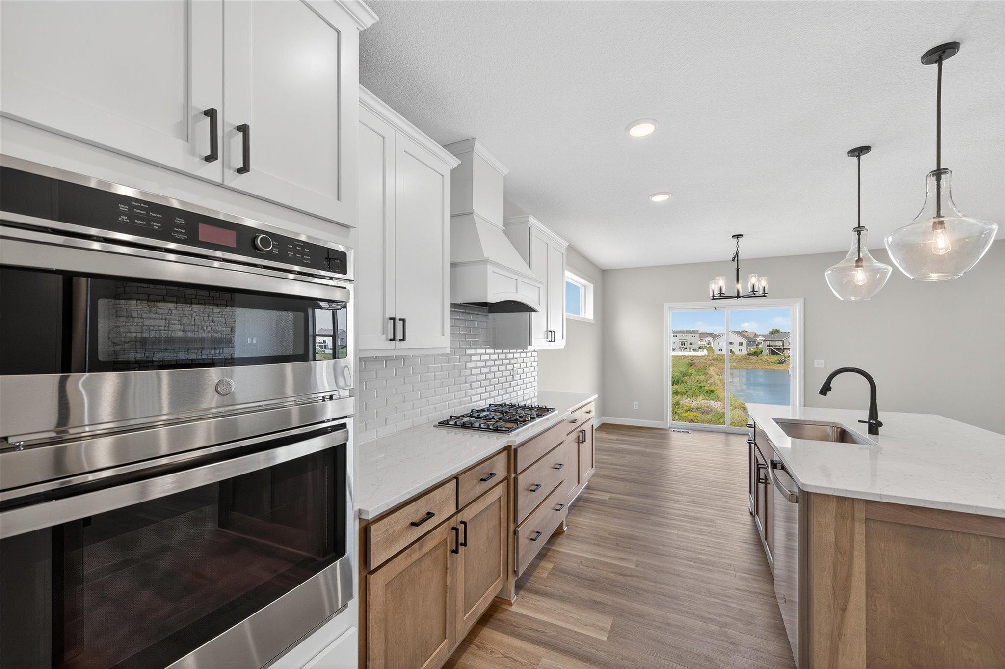 Kitchen - photo is of a previous inventory home. Inquire for more details and options.