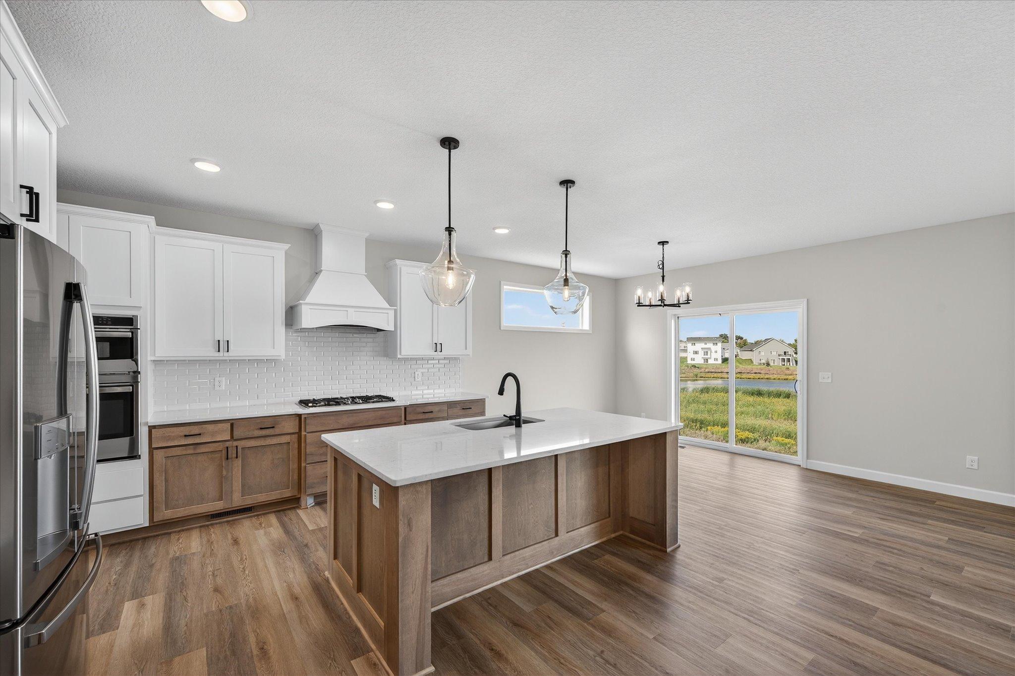 Kitchen - photo is of a previous inventory home. Inquire for more details and options.