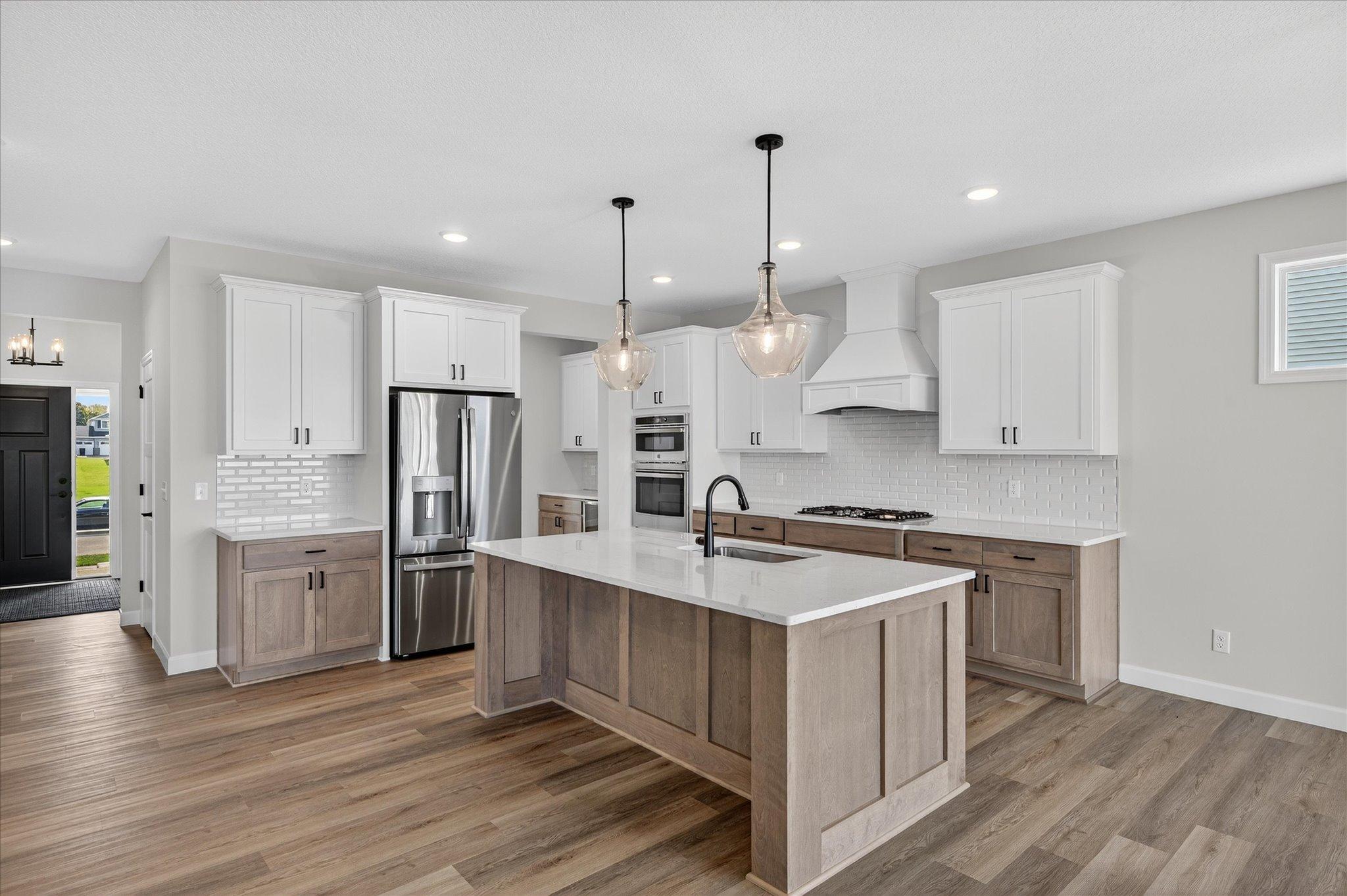 Kitchen - photo is of a previous inventory home. Inquire for more details and options.