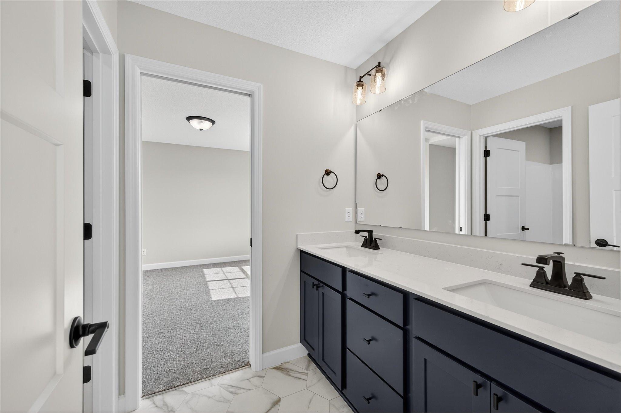 Jack & Jill Bathroom - photo is of a previous inventory home. Inquire for more details and options.