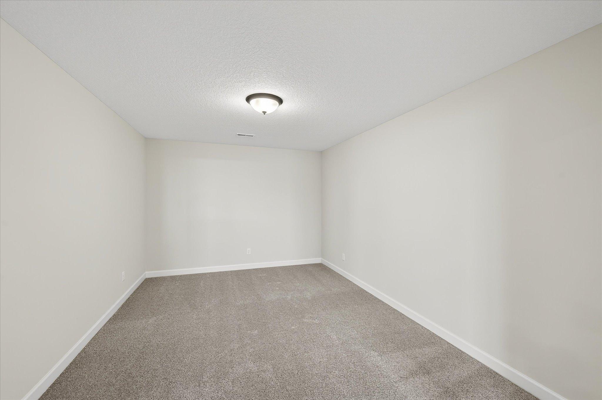 Lower Level Game Room - photo is of a previous inventory home. Inquire for more details and options.