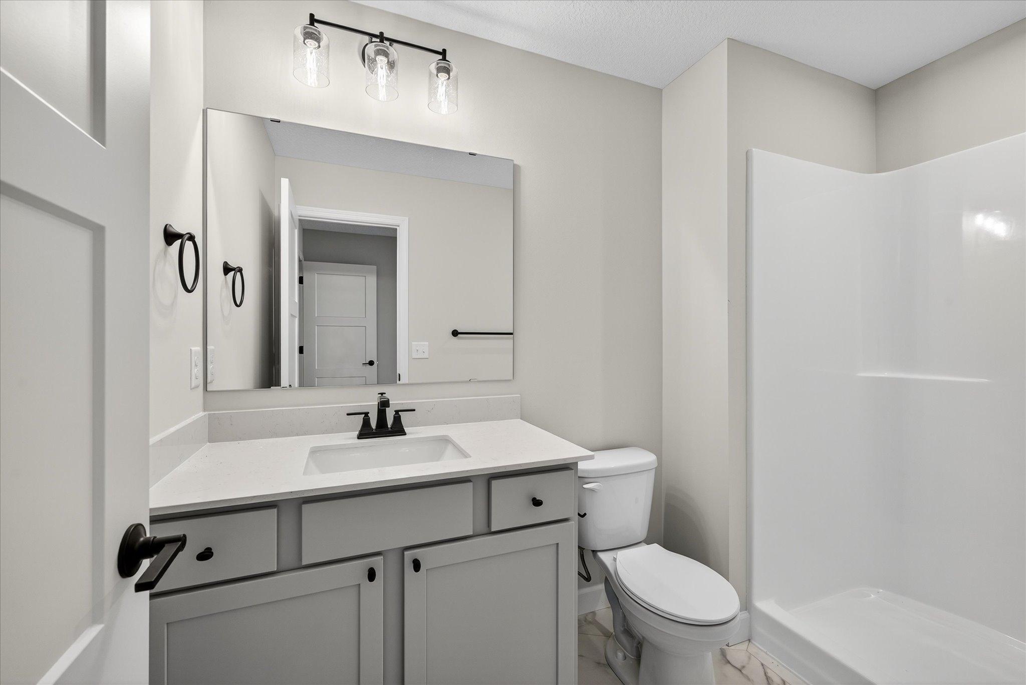 Bathroom - photo is of a previous inventory home. Inquire for more details and options.