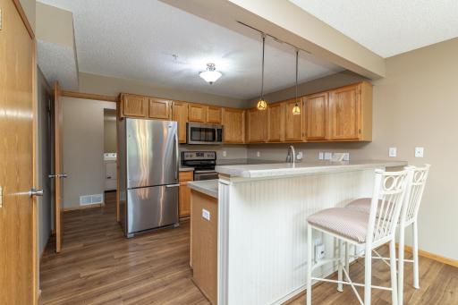Two tiered kitchen counter with breakfast counter