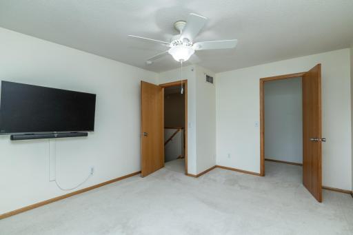 Primary bedroom wth walk-in closet and pass through to bathroom