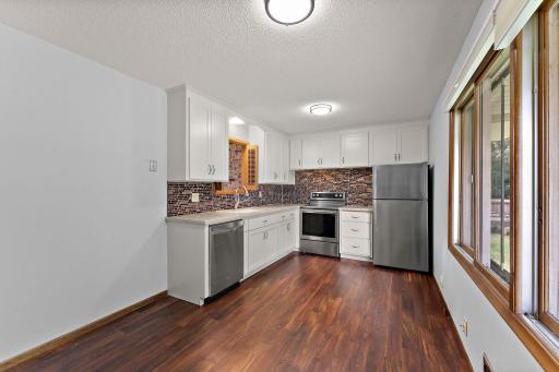 The kitchen/dining room has space for adding a dining table for enjoying backyard views during mealtime.