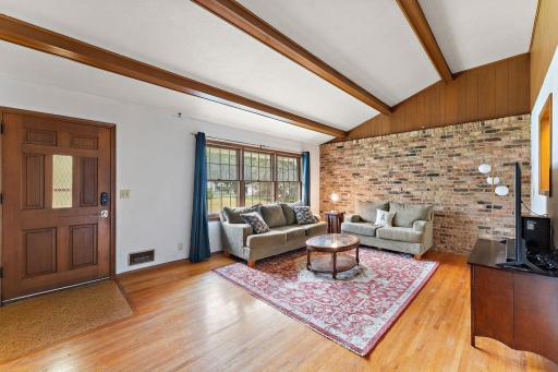 The front door of the home is on the left and note the beautiful hardwood floor!