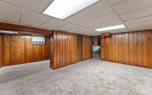 The first floor, basement level, has plenty of finished, carpeted space and, has a closet area as well near the stairs. The stairs lead to the lower/second floor and laundry area.