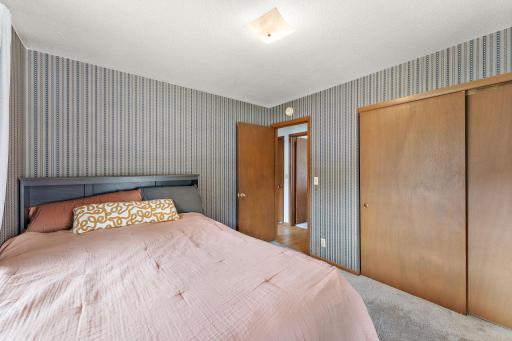The second bedroom is carpeted and has a large closet.