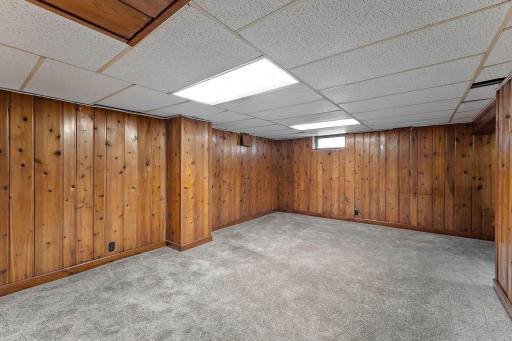 Another view of the basement first level finished and carpeted which could be used as an office space.