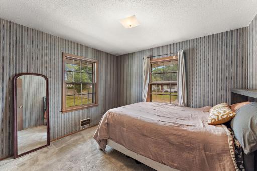 The second bedroom has two windows with a street view.
