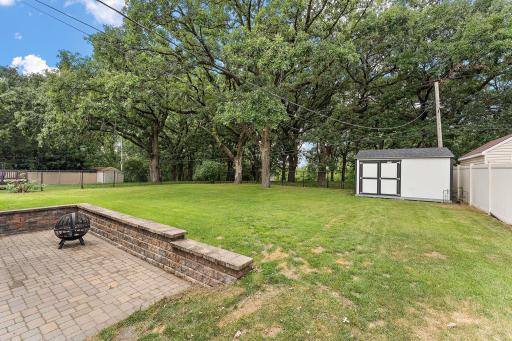 The patio has a paver retaining wall and room for hosting backyard BBQ's with friends. The garden shed is perfect for storing lawn tools and equipment.