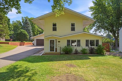 Classic architectural lines, low-maintenance vinyl siding, large front-facing windows that fill the interior with natural light, and a covered front entry that is warm and welcoming.