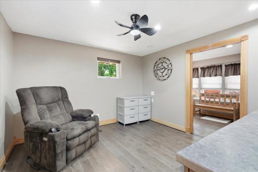 Versatile main-level office is thoughtfully designed with a built-in desk, custom cabinetry, and ample storage, making it the perfect workspace for working from home.