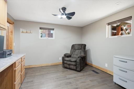Updated windows, rich custom wood trim, durable luxury vinyl plank flooring, and convenient pocket doors add both style and functionality.
