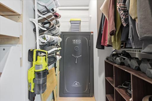 Generous walk-in hallway closet provides exceptional storage with custom roll-out shelving, built-in organizers, hanging space, and room for seasonal items, making it an ideal extension of the home's thoughtful storage solutions.