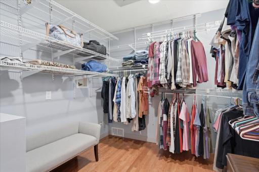 Expansive walk-in closet is thoughtfully designed with an abundance of shelving, hanging space, and built-in organizers. An added bonus is the washer and dryer hookups, offering the option for convenient upper-level laundry.