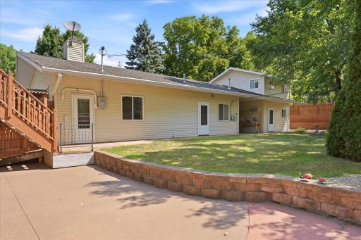 The private fully fenced backyard offers direct access to the oversized 2 car garage and detached studio/office building.