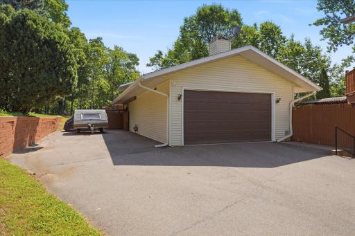Oversized two-car garage is complemented by an expansive driveway offering abundant off-street parking. The attached 21' x 15' workshop provides the perfect space for storage, or projects.