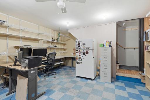 Ideal for a home office, creative studio, workshop office, or project room. Convenient stairway provides direct access to the upper-level studio.