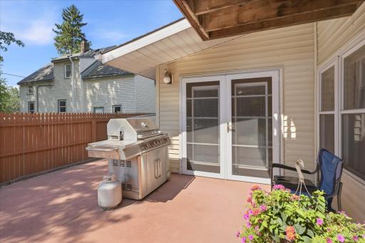 Walk out to the spacious patio featuring easy access to the home, plenty of room for outdoor seating, and a dedicated grilling area, perfect for hosting throughout the season.