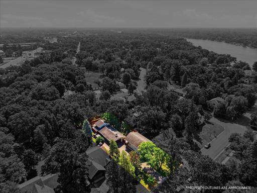 Approximate property lines illustrate the generous footprint of this unique property, showcasing the spacious .33 acre lot, detached two-story studio, extensive outdoor living areas, and private fenced backyard.