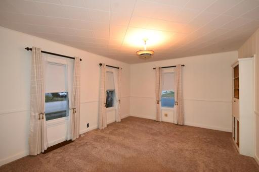 main floor living room or potential 4th bedroom