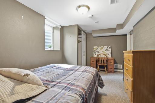 Room 6 Bed, Dresser, Desk and chair in lower level with Egress..jpg