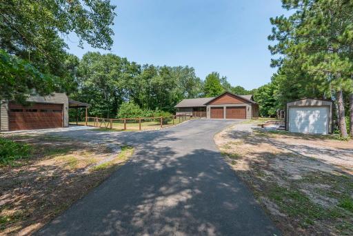Front yard, detached garage, and storage shed