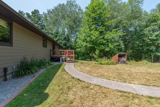 Paved path from deck to backyard firepit