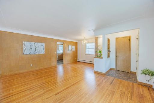 Notice the gleaming original hardwood floors that add timeless charm and warmth throughout the main level, with exception of kitchen.