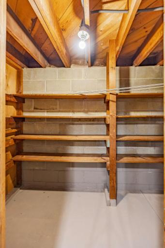 Maximize your storage right next to the bathroom, where the pristine, intact condition of the block walls and floor highlights the home's solid foundation.
