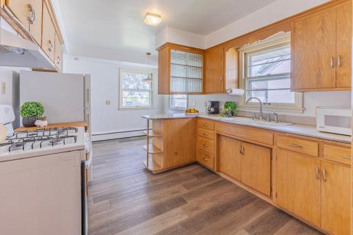 Notice how bright and open the kitchen feels with all that natural light.