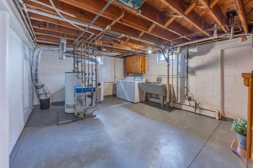 Rarely do you see a utility room of this size, highlighting exceptionally solid walls and floors that show pride of ownership.
