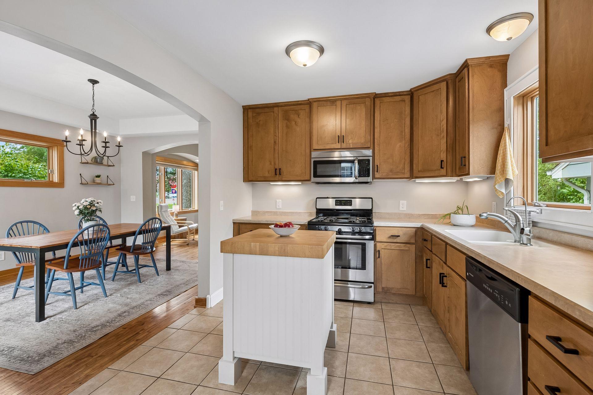 Kitchen opens up perfectly to the dining room. (Kitchen island is movable and not included)