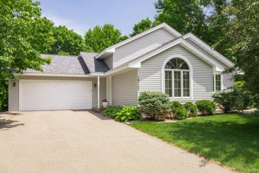 Wonderful curb appeal that shows off landscape and newer siding and roof located on quiet cul-de-sac