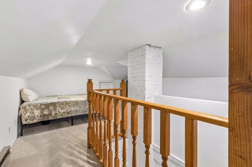 The upper level consists of an extra bonus space, or non-conforming bedroom.