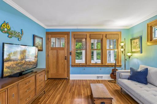 Once inside you're greeted with warm woodwork throughout the living and dining spaces.