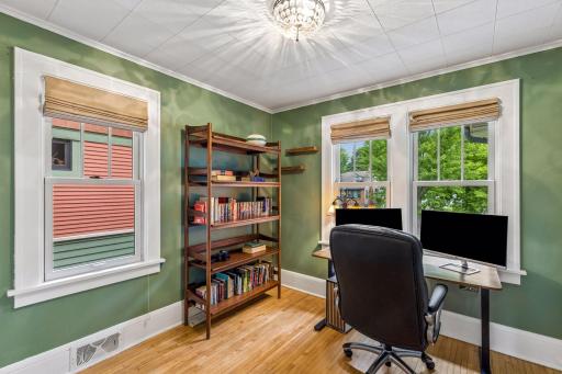 The additional main floor bedroom faces north and is currently being used as an office.