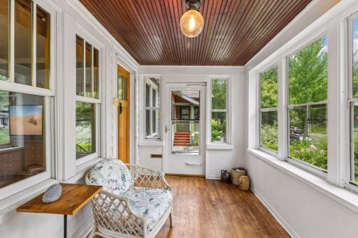 Step inside the three season front porch, complete with original beadboard ceiling.