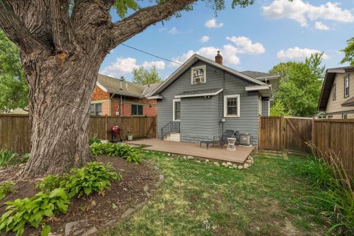Outside is a fully fenced in yard with deck.