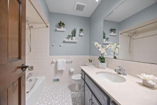 The upper level full bath features a large vanity that could be turned into a double sink vanity.