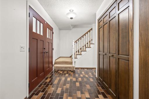 The foyer off the large front entrance features a large front entry closet.