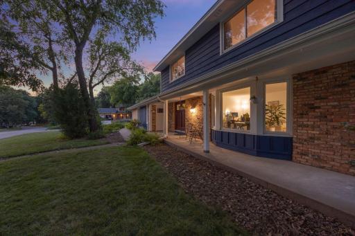A spacious front porch wrapping the entire front of the house, great to enjoy a morning coffee or relax in the evenings.