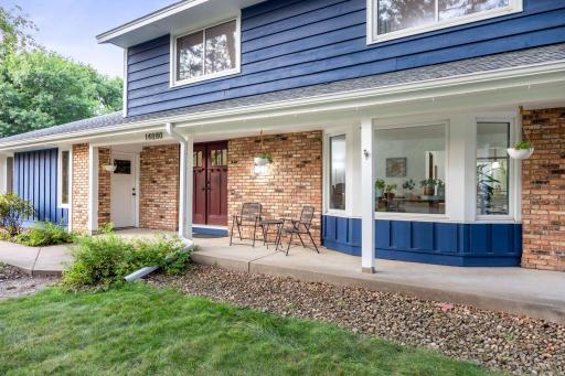 Double front doors and additional side door access to the garage from the exterior.